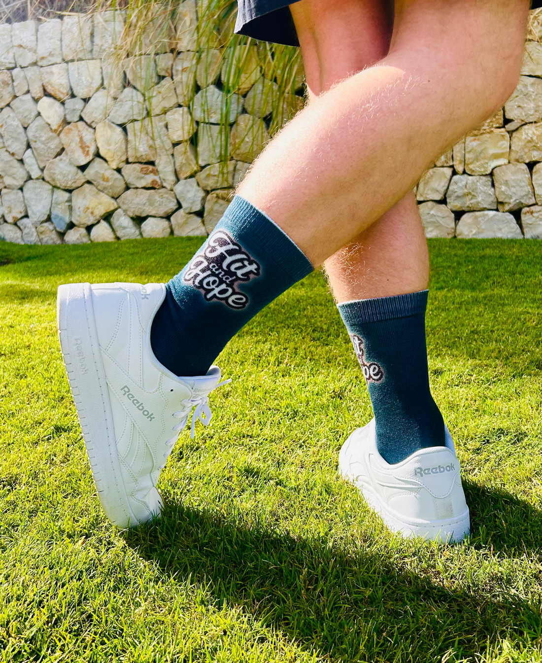 Two pairs of HIT AND HOPE golf socks lifestyle photo